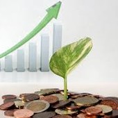 pianta che spunta tra soldi e grafico in crescita pianta che spunta tra soldi e grafico in crescita