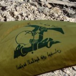 Milano, in corteo con bandiera Hezbollah: indagata per istigazione a terrorismo Milano, in corteo con bandiera Hezbollah: indagata per istigazione a terrorismo